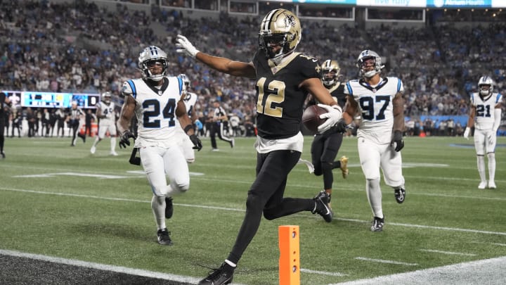 Sep 18, 2023; Charlotte, North Carolina, USA; New Orleans Saints wide receiver Chris Olave (12) crosses the goal line but was ruled to have stepped out of bounds earlier on the play in the fourth quarter at Bank of America Stadium. Sep 18, 2023; Charlotte, North Carolina, USA; New Orleans Saints wide receiver Chris Olave (12) crosses the goal line but was ruled to have stepped out of bounds earlier on the play in the fourth quarter at Bank of America Stadium.