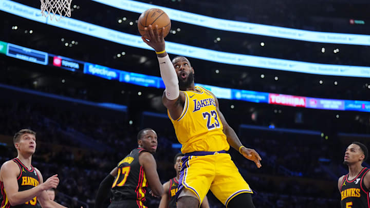 Mar 18, 2024; Los Angeles, California, USA; Los Angeles Lakers forward LeBron James (23) shoots the ball against Atlanta Hawks forward Onyeka Okongwu (17) in the second half at Crypto.com Arena. Mandatory Credit: Kirby Lee-Imagn Images