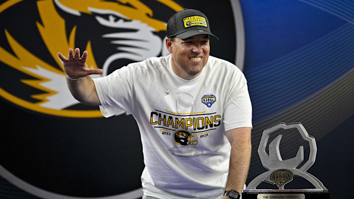 Dec 29, 2023; Arlington, TX, USA; Missouri Tigers head coach Eliah Drinkwitz celebrates on the stage after Missouri defeated Ohio State in the Cotton Bowl