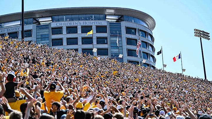 Sep 2, 2023; Iowa City, Iowa, USA; Fans at Kinnick Stadium during the game between the Iowa Hawkeyes and the Utah State Aggies do the Iowa Wave with the University of Iowa Stead Family Children's Hospital. Mandatory Credit: Jeffrey Becker-USA TODAY Sports