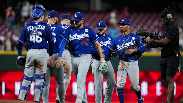 Sep 15, 2026; Cincinnati, Ohio, USA; Los Angeles Dodgers shortstop Mookie Betts, right, celebrates with teammates after defeating the Cincinnati Reds at Great American Ball Park. Mandatory Credit: Aaron Doster-Imagn Images Sep 15, 2026; Cincinnati, Ohio, USA; Los Angeles Dodgers shortstop Mookie Betts, right, celebrates with teammates after defeating the Cincinnati Reds at Great American Ball Park. Mandatory Credit: Aaron Doster-Imagn Images