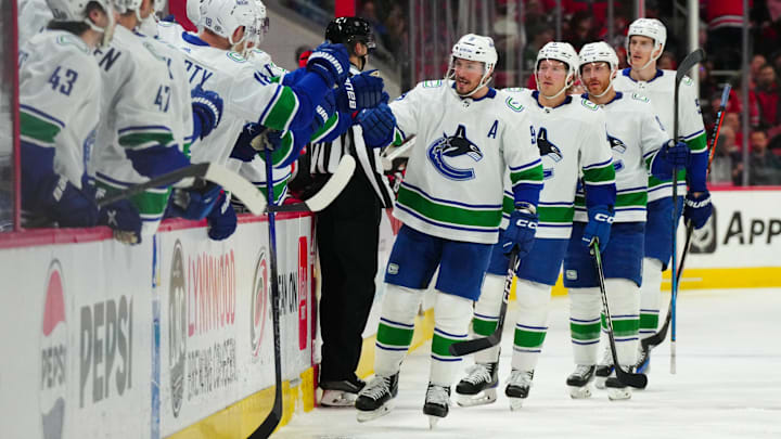 Feb 6, 2024; Raleigh, North Carolina, USA; Vancouver Canucks center J.T. Miller (9) celebrates his