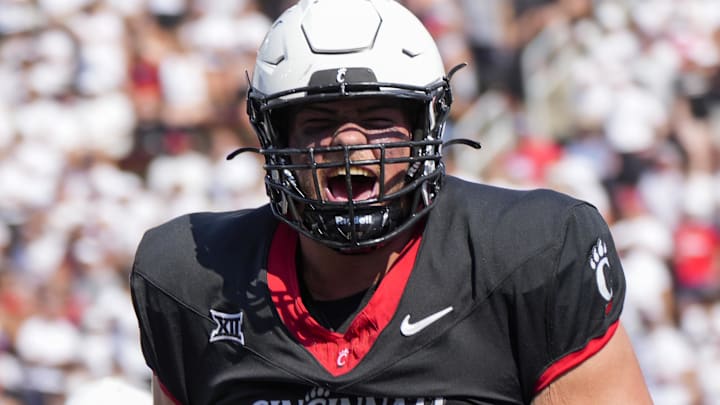 Sep 2, 2023; Cincinnati, Ohio, USA; Cincinnati Bearcats offensive lineman Luke Kandra (67) celebrates after Cincinnati Bearcats tight end Payten Singletary (not pictured) scored a touchdown during the first half of the NCAA football game between the Cincinnati Bearcats and the Eastern Kentucky Colonels at Nippert Stadium. Mandatory Credit: Carter Skaggs-Imagn Images Sep 2, 2023; Cincinnati, Ohio, USA; Cincinnati Bearcats offensive lineman Luke Kandra (67) celebrates after Cincinnati Bearcats tight end Payten Singletary (not pictured) scored a touchdown during the first half of the NCAA football game between the Cincinnati Bearcats and the Eastern Kentucky Colonels at Nippert Stadium. Mandatory Credit: Carter Skaggs-Imagn Images