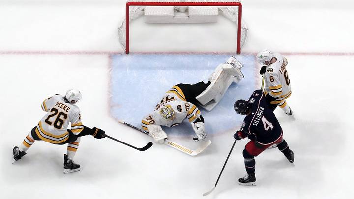 Apr 12, 2026; Columbus, Ohio, USA; Boston Bruins goalie Joonas Korpisalo (70) makes a save as Columbus Blue Jackets center Cole Sillinger (4) looks for a rebound during the third period at Nationwide Arena. Mandatory Credit: Russell LaBounty-Imagn Images