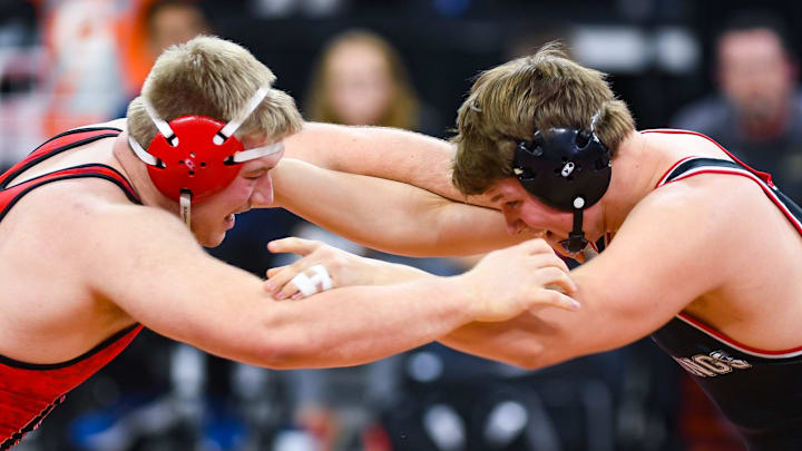 Chamberlain's Nash Hutmacher and Brookings' Gus Miller compete in the feature class A match of the