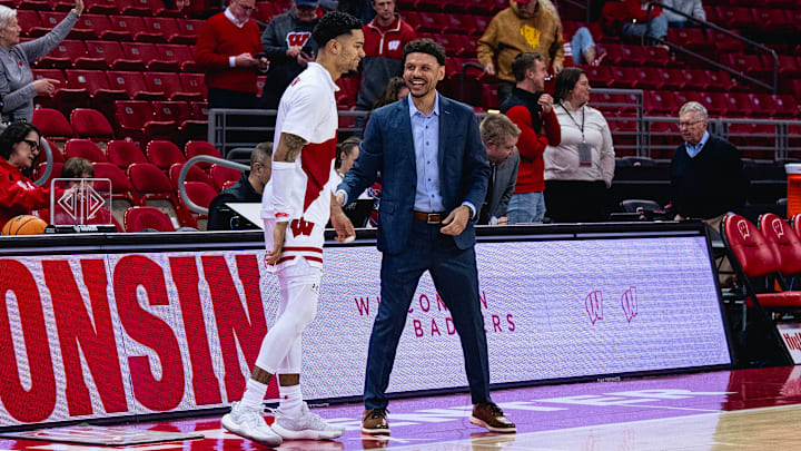 Point guard Nick Boyd (left) and Wisconsin Director of Recruiting and Scouting Isaac Wodajo chat before a game at the Kohl Center. Point guard Nick Boyd (left) and Wisconsin Director of Recruiting and Scouting Isaac Wodajo chat before a game at the Kohl Center.
