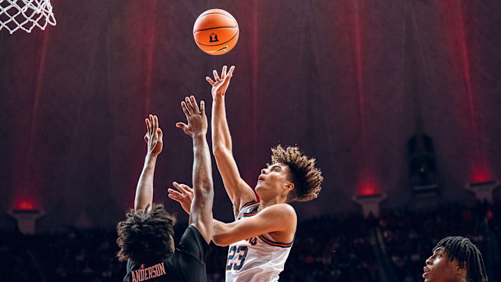 Illinois guard Keaton Wagler (23) launches a floater over Texas Tech's Christian Anderson in the Illini's 81-77 win over the Red Raiders last week at the State Farm Center in Champaign, Illinois.