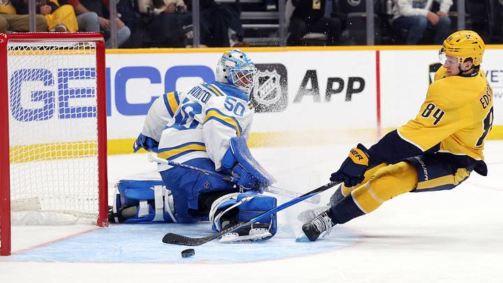 Oct 17, 2026; Nashville, Tennessee, USA;  Nashville Predators center Adam Edstrom (84) is unable to get the puck past St. Louis Blues goaltender Jordan Binnington (50) during the third period at Bridgestone Arena.  Mandatory Credit: Alan Poizner-Imagn Images