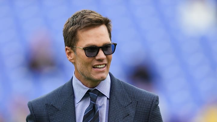 Oct 12, 2025; Baltimore, Maryland, USA; Fox Sports announcer Tom Brady looks on before the game between the Baltimore Ravens and the Los Angeles Rams at M&T Bank Stadium. Mandatory Credit: Mitch Stringer-Imagn Images
