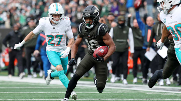Dec 7, 2025; East Rutherford, New Jersey, USA; New York Jets wide receiver Isaiah Williams (18) returns a punt for a touchdown against the Miami Dolphins during the first half at MetLife Stadium. Mandatory Credit: Vincent Carchietta-Imagn Images Dec 7, 2025; East Rutherford, New Jersey, USA; New York Jets wide receiver Isaiah Williams (18) returns a punt for a touchdown against the Miami Dolphins during the first half at MetLife Stadium. Mandatory Credit: Vincent Carchietta-Imagn Images