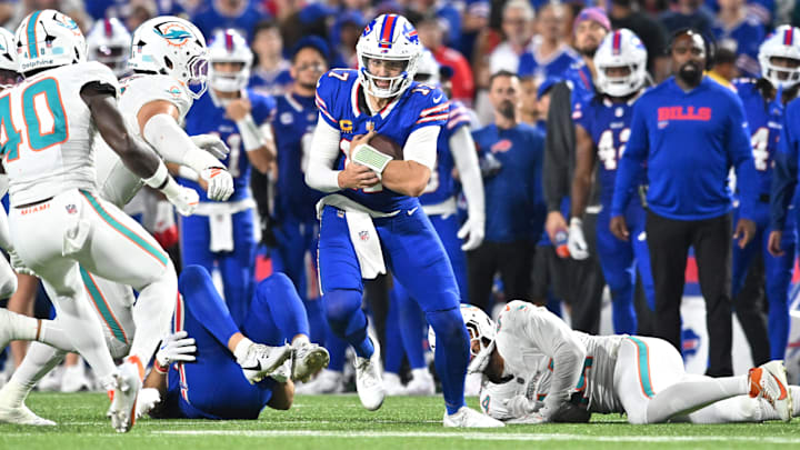 Buffalo Bills quarterback Josh Allen (17) runs the ball against the Miami Dolphins in the second half at Highmark Stadium. Buffalo Bills quarterback Josh Allen (17) runs the ball against the Miami Dolphins in the second half at Highmark Stadium.