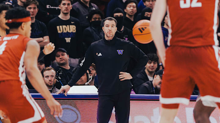 Danny Sprinkle watches the Huskies face Illinois. 