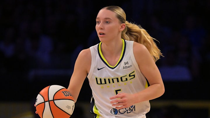 Sep 7, 2025; Los Angeles, California, USA;  Dallas Wings guard Paige Bueckers (5) handles the ball during the first half against the Los Angeles Sparks at Crypto.com Arena. Mandatory Credit: Jayne Kamin-Oncea-Imagn Images