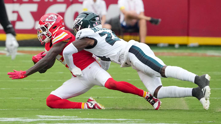 Sep 14, 2025; Kansas City, Missouri, USA; Philadelphia Eagles safety Andrew Mukuba (24) tackles Kansas City Chiefs wide receiver Hollywood Brown (5) during the third quarter of the game at GEHA Field at Arrowhead Stadium. Mandatory Credit: Denny Medley-Imagn Images