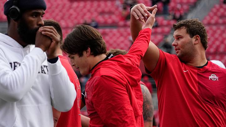 Ohio State Buckeyes offensive lineman Luke Montgomery (51) and quarterback Julian Sayin (10) warm up prior to the NCAA football game against the Penn State Nittany Lions at Ohio Stadium in Columbus on Nov. 1, 2025. Ohio State Buckeyes offensive lineman Luke Montgomery (51) and quarterback Julian Sayin (10) warm up prior to the NCAA football game against the Penn State Nittany Lions at Ohio Stadium in Columbus on Nov. 1, 2025.