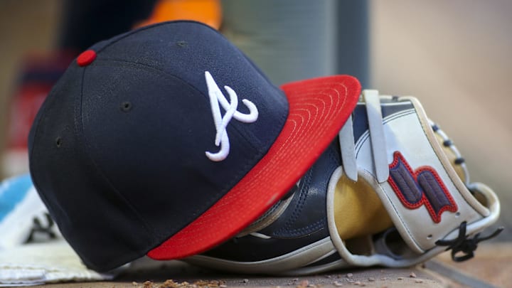 May 31, 2019; Atlanta, GA, USA; Detailed view of hat and glove of Atlanta Braves center fielder Ronald Acuna Jr. (not pictured) against the Detroit Tigers in the fourth inning at SunTrust Park. Mandatory Credit: Brett Davis-Imagn Images
