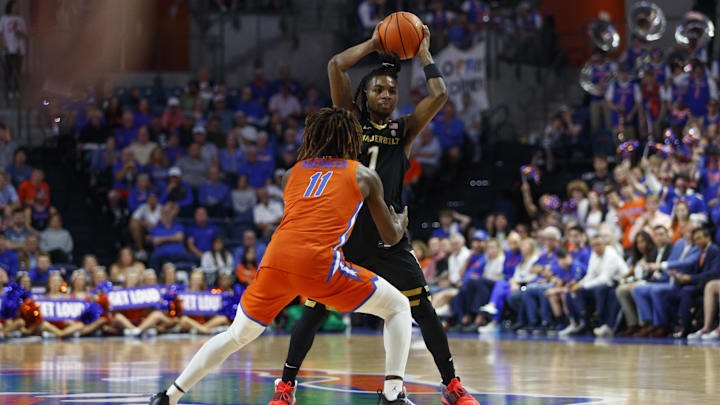 Feb 4, 2025; Gainesville, Florida, USA; Florida Gators guard Denzel Aberdeen (11) guards Vanderbilt Commodores guard Jason Edwards (1) during the first half at Exactech Arena at the Stephen C. O'Connell Center. Mandatory Credit: Morgan Tencza-Imagn Images