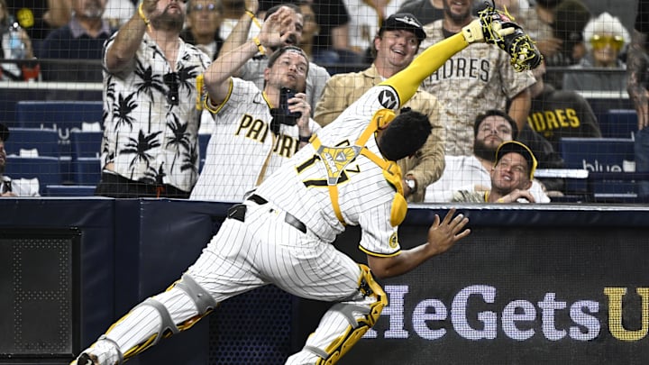 Jul 10, 2025; San Diego, California, USA; San Diego Padres catcher Elias Diaz (17) makes the catch on a foul ball hit by Arizona Diamondbacks right fielder Randal Grichuk (15) during the eighth inning at Petco Park. Mandatory Credit: Denis Poroy-Imagn Images