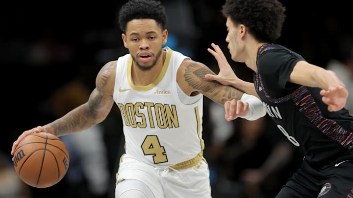 Jan 23, 2026; Brooklyn, New York, USA; Boston Celtics guard Anfernee Simons (4) brings the ball up court against Brooklyn Nets guard Nolan Traore (88) during the first quarter at Barclays Center. Jan 23, 2026; Brooklyn, New York, USA; Boston Celtics guard Anfernee Simons (4) brings the ball up court against Brooklyn Nets guard Nolan Traore (88) during the first quarter at Barclays Center.