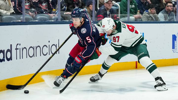 Dec 18, 2025; Columbus, Ohio, USA;  Columbus Blue Jackets defenseman Denton Mateychuk (5) skates with the puck against Minnesota Wild left wing Kirill Kaprizov (97) in the second period at Nationwide Arena. Mandatory Credit: Aaron Doster-Imagn Images