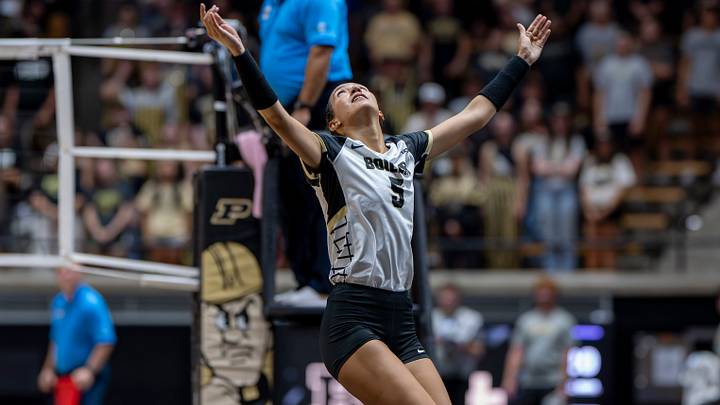 Purdue senior setter Taylor Anderson returns a dig.
