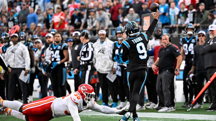 Nov 24, 2024; Charlotte, North Carolina, USA; Carolina Panthers quarterback Bryce Young (9) passes the ball as Kansas City Chiefs defensive tackle Tershawn Wharton (98) pressures in the fourth quarter at Bank of America Stadium. Mandatory Credit: Bob Donnan-Imagn Images