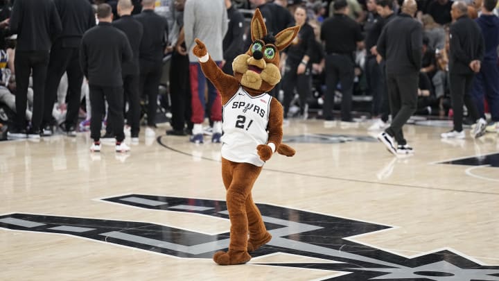 Mar 15, 2024; Austin, Texas, USA; San Antonio Spurs mascot Coyote excites fans during a timeout in the second half against the Denver Nuggets at Moody Center. Mar 15, 2024; Austin, Texas, USA; San Antonio Spurs mascot Coyote excites fans during a timeout in the second half against the Denver Nuggets at Moody Center.