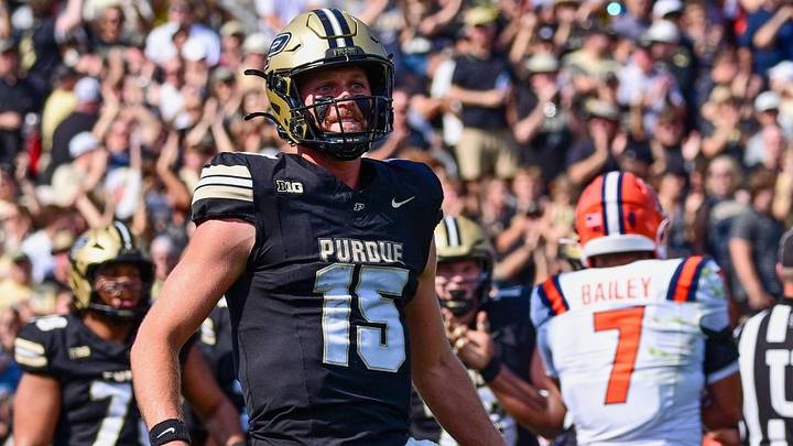 Purdue Boilermakers quarterback Ryan Browne (15) runs to celebrate a touchdown. Purdue Boilermakers quarterback Ryan Browne (15) runs to celebrate a touchdown.