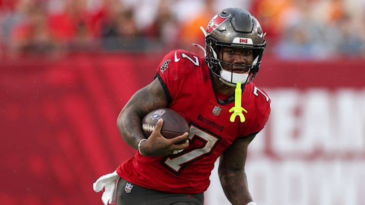 Dec 29, 2024; Tampa, Florida, USA; Tampa Bay Buccaneers running back Bucky Irving (7) runs with the ball against the Carolina Panthers in the third quarter at Raymond James Stadium. Mandatory Credit: Nathan Ray Seebeck-Imagn Images