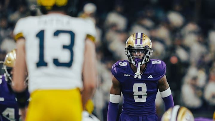 Cam Broussard keeps an eye on Michigan QB Jack Tuttle. 