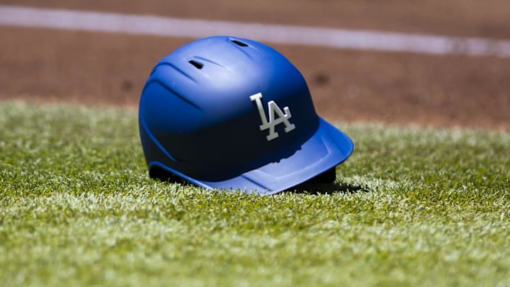 Apr 27, 2022; Phoenix, Arizona, USA; Detailed view of a Los Angeles Dodgers batting helmet on the field against the Arizona Diamondbacks at Chase Field. Mandatory Credit: Mark J. Rebilas-Imagn Images