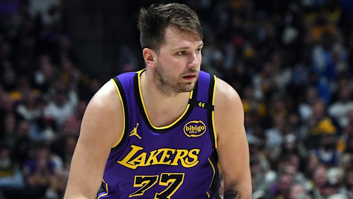 Feb 22, 2025; Denver, Colorado, USA; Los Angeles Lakers guard Luka Doncic (77) handles the ball during the second half against the Denver Nuggets at Ball Arena. Mandatory Credit: Christopher Hanewinckel-Imagn Images
