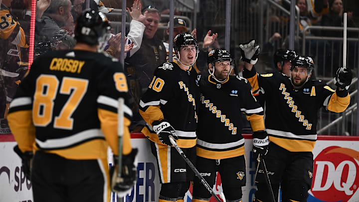 Pittsburgh Penguins players celebrating a goal scored