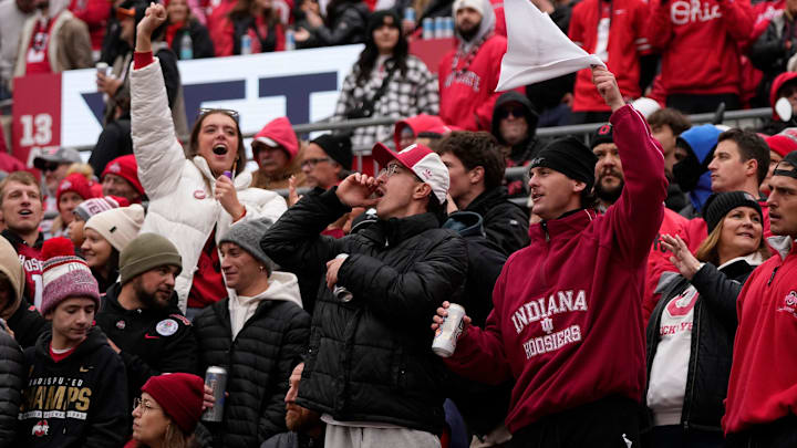 Indiana Hoosiers fans cheer after their team scored a touchdown during the first half of the NCAA football game against the Ohio State Buckeyes at Ohio Stadium in Columbus on Saturday, Nov. 23, 2024.