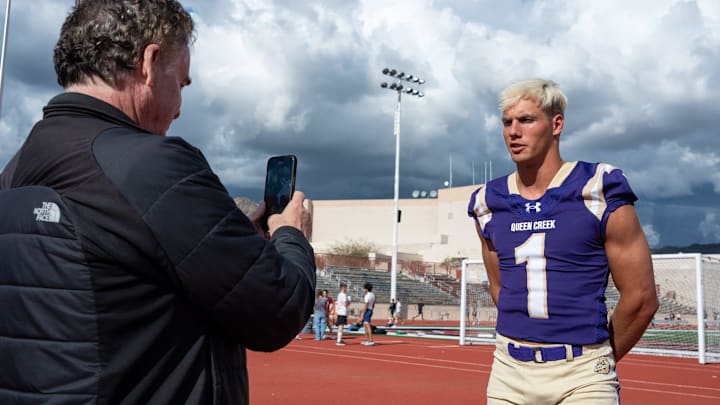 Queen Creek High Schoolâ€™s Tait Reynolds does a short interview with recruiting analyst, Tom Lemmings at the Desert Mountain High School football field on April 1, 2024 in Scottsdale, Ariz.