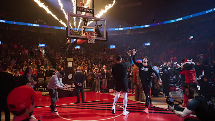Jan 11, 2025; Portland, Oregon, USA: Portland Trail Blazers forward Deni Avdija (8) high-fives  forward Toumani Camara (33) during introductions before a game against the Miami Heat at Moda Center. Mandatory Credit: Troy Wayrynen-Imagn Images