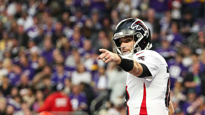 Dec 8, 2024; Minneapolis, Minnesota, USA; Atlanta Falcons quarterback Kirk Cousins (18) celebrates running back Bijan Robinson's (7) touchdown against the Minnesota Vikings during the third quarter at U.S. Bank Stadium. Mandatory Credit: Matt Krohn-Imagn Images