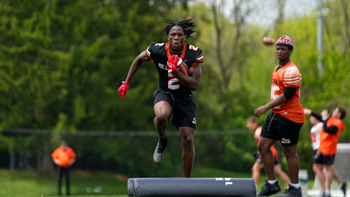 Delaware Hayes’s Favour Akih (2) participates in a drill during the college football showcase at the Delaware Hayes High School on Wednesday, May 7, 2025 in Delaware, Ohio.