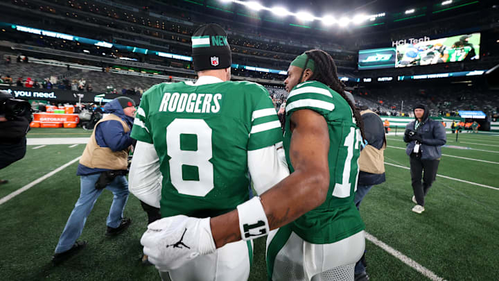 Jan 5, 2025; East Rutherford, New Jersey, USA; New York Jets quarterback Aaron Rodgers (8) and wide receiver Davante Adams (17) walk on the field after the Jets win over the Miami Dolphins at MetLife Stadium. Mandatory Credit: Ed Mulholland-Imagn Images Jan 5, 2025; East Rutherford, New Jersey, USA; New York Jets quarterback Aaron Rodgers (8) and wide receiver Davante Adams (17) walk on the field after the Jets win over the Miami Dolphins at MetLife Stadium. Mandatory Credit: Ed Mulholland-Imagn Images