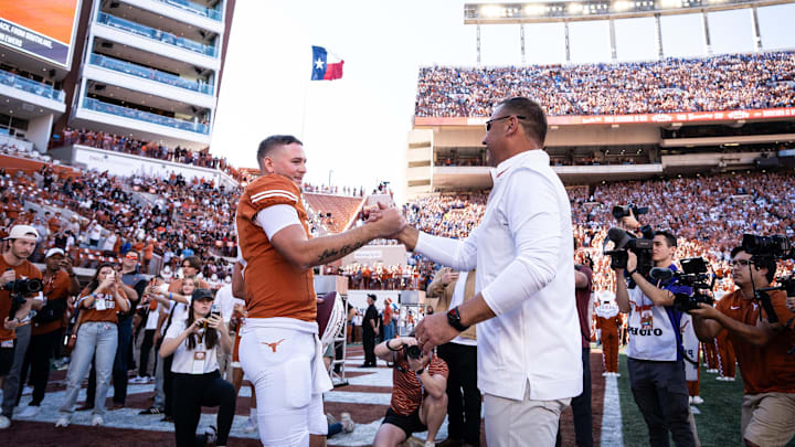 Nov 23, 2024; Austin, Texas, USA; Texas Longhorns head coach Steve Sarkisian embraces quarterback Quinn Ewers (3) as Ewers is honored as one of Texas' seniors in their last home game of the season against the Kentucky Wildcats at Darrell K Royal Texas Memorial Stadium. Mandatory Credit: Sara Diggins/USA TODAY Network via Imagn Images