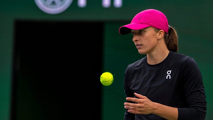 Iga Swiatek gets ready for a serve to Marta Kostyuk during the WTA semifinals of the BNP Paribas Open in Indian Wells, Calif.