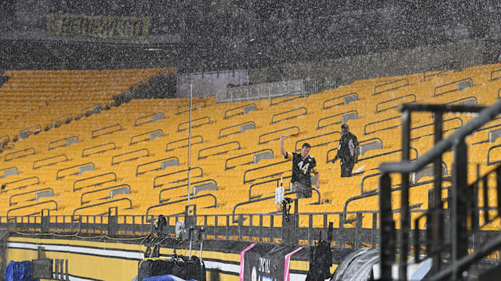 Steelers fans brave the elements to... be in the elements. Steelers fans brave the elements to... be in the elements.