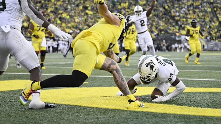 Oct 4, 2024; Eugene, Oregon, USA; Michigan State Spartans defensive back Malik Spencer (43) intercepts a pass during the first half against the Oregon Ducks at Autzen Stadium. Mandatory Credit: Troy Wayrynen-Imagn Images