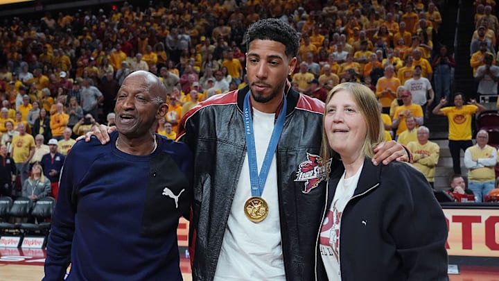 March 1, 2025: Pacers guard Tyrese Haliburton holds his parents John and Brenda Haliburton.