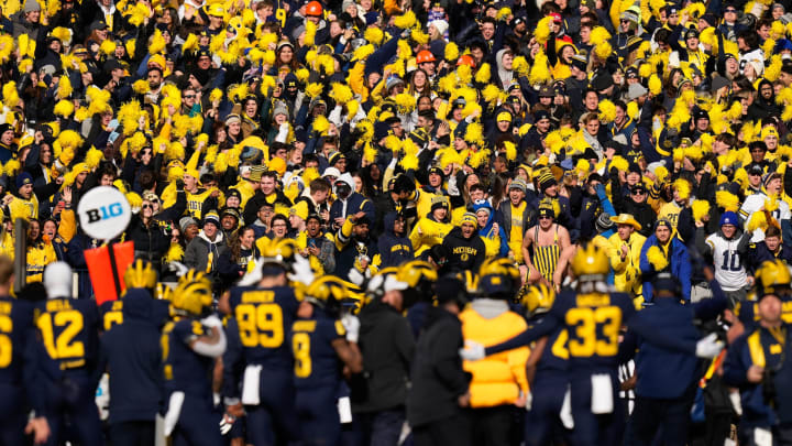 Nov 25, 2023; Ann Arbor, Michigan, USA; Michigan Wolverines fans cheer during the NCAA football game against the Ohio State Buckeyes at Michigan Stadium. Ohio State lost 30-24. Nov 25, 2023; Ann Arbor, Michigan, USA; Michigan Wolverines fans cheer during the NCAA football game against the Ohio State Buckeyes at Michigan Stadium. Ohio State lost 30-24.