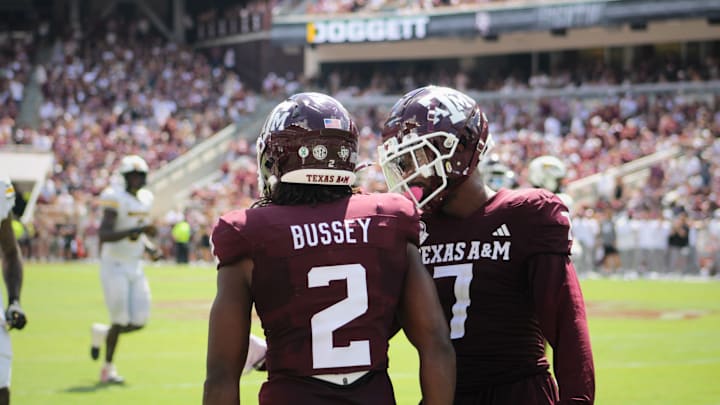 Texas A&M Aggies' Terry Bussey (2) and Moose Muhammad III (7) talk on the field against the Missouri Tigers at Kyle Field. 