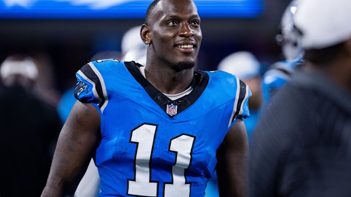 Aug 8, 2025; Charlotte, North Carolina, USA; Carolina Panthers linebacker Nic Scourton (11) walks the sideline during the third quarter against the Cleveland Browns at Bank of America Stadium. 