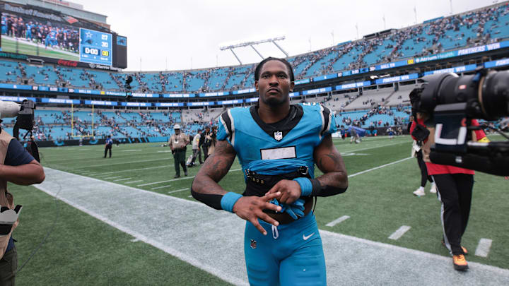 Oct 12, 2025; Charlotte, North Carolina, USA; Carolina Panthers running back Rico Dowdle (5) looks on after the game against the Dallas Cowboys at Bank of America Stadium. 
