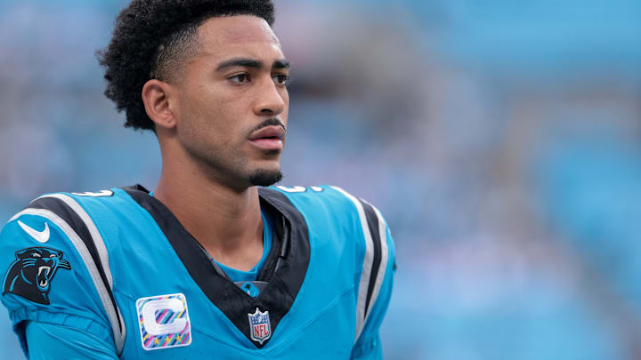 Oct 12, 2025; Charlotte, North Carolina, USA; Carolina Panthers quarterback Bryce Young (9) looks on before the game against the Dallas Cowboys at Bank of America Stadium. 