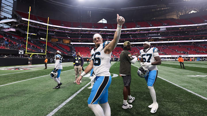 Nov 16, 2025; Atlanta, Georgia, USA; Carolina Panthers kicker Ryan Fitzgerald (10) shakes hands with teammates after scoring the game winning field goal against the Atlanta Falcons at Mercedes-Benz Stadium. 